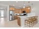 Modern kitchen with a breakfast bar and stainless steel appliances at 10274 Hadley St, Orlando, FL 32829