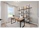 Bright home office features built-in shelving and a spacious work desk at 10274 Hadley St, Orlando, FL 32829
