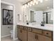 Double vanity bathroom with modern fixtures and finishes at 10274 Hadley St, Orlando, FL 32829