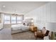 Main bedroom with plush carpet and a large window at 10274 Hadley St, Orlando, FL 32829