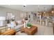 Open concept living space showcasing a stylish sofa and kitchen at 10274 Hadley St, Orlando, FL 32829
