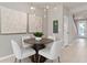 Elegant dining area features a round table with four chairs at 10274 Hadley St, Orlando, FL 32829