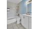 Updated bathroom with white vanity, new fixtures, and a shower/tub combo at 1836 N Crystal Lake Dr # 31, Lakeland, FL 33801