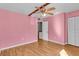 Spacious bedroom featuring wood floors and a ceiling fan at 1836 N Crystal Lake Dr # 31, Lakeland, FL 33801