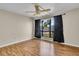 Bedroom with wood floors, large window, and ceiling fan at 1836 N Crystal Lake Dr # 31, Lakeland, FL 33801