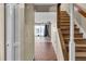 Tile entryway with wooden staircase and access to living area at 1836 N Crystal Lake Dr # 31, Lakeland, FL 33801