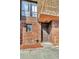 Brick building exterior with a brown door and walkway at 1836 N Crystal Lake Dr # 31, Lakeland, FL 33801