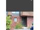Brick building exterior with a brown door and landscaping at 1836 N Crystal Lake Dr # 31, Lakeland, FL 33801
