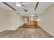 Open living area with wood-look floors and exposed beams at 1836 N Crystal Lake Dr # 31, Lakeland, FL 33801