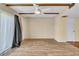 Bright living room with wood-look floors and sliding glass doors at 1836 N Crystal Lake Dr # 31, Lakeland, FL 33801