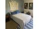 Bedroom with a wall hanging and striped rug at 2030 Cascades Blvd # 302, Kissimmee, FL 34741