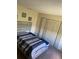 Bedroom with large closet and double bed at 2030 Cascades Blvd # 302, Kissimmee, FL 34741
