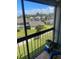 View of the community from a balcony, featuring green spaces and residential buildings at 2030 Cascades Blvd # 302, Kissimmee, FL 34741