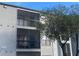 Two-story building with balconies and screened-in patios at 2030 Cascades Blvd # 302, Kissimmee, FL 34741