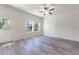 Bright living room featuring vinyl plank flooring and large windows at 2076 Cades Cove Way, Deland, FL 32720