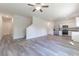 Open living room with vinyl plank flooring and neutral paint at 2076 Cades Cove Way, Deland, FL 32720