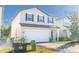 Two-story house with a white garage door and landscaping at 2076 Cades Cove Way, Deland, FL 32720