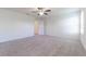 Spacious bedroom with neutral carpeting and ceiling fan at 2076 Cades Cove Way, Deland, FL 32720