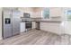 Modern kitchen with stainless steel appliances and granite countertops at 2076 Cades Cove Way, Deland, FL 32720