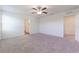 Spacious bedroom with neutral carpeting and ceiling fan at 2076 Cades Cove Way, Deland, FL 32720
