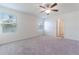 Spacious bedroom with neutral carpeting and ceiling fan at 2076 Cades Cove Way, Deland, FL 32720