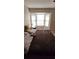 Spacious bedroom with large window and plush bedding at 2314 Carriage Run Rd, Kissimmee, FL 34741
