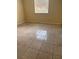 Bright bedroom with tile flooring and large window at 2802 N Powers Dr # 18, Orlando, FL 32818