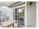 Private patio with sliding glass doors, table, and chairs at 3177 Feltrim Pl # 104, Kissimmee, FL 34747