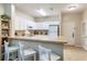 Efficient kitchen with white cabinets, breakfast bar and modern appliances at 3177 Feltrim Pl # 104, Kissimmee, FL 34747