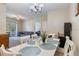 White dining table with chairs, overlooks the living room at 3177 Feltrim Pl # 104, Kissimmee, FL 34747