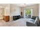 Living room with gray sofa and sliding glass doors to balcony at 3177 Feltrim Pl # 104, Kissimmee, FL 34747