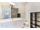 Clean bathroom with white vanity, shower, and storage at 3177 Feltrim Pl # 104, Kissimmee, FL 34747
