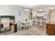 Dining area with white table and chairs, workspace and kitchen access at 3177 Feltrim Pl # 104, Kissimmee, FL 34747