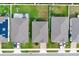 Three houses seen from above with gray roofs and green yards at 416 Mckenna Dr, Winter Haven, FL 33881