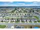 Community overview featuring numerous houses and a lake at 416 Mckenna Dr, Winter Haven, FL 33881