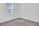 Cozy bedroom with window, neutral walls, and carpet at 416 Mckenna Dr, Winter Haven, FL 33881