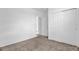 Simple bedroom with double door closet and carpet at 416 Mckenna Dr, Winter Haven, FL 33881