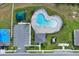 Aerial view of community pool, clubhouse, and parking at 416 Mckenna Dr, Winter Haven, FL 33881