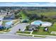 Community pool with lounge chairs, a clubhouse, and parking at 416 Mckenna Dr, Winter Haven, FL 33881