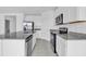Modern kitchen with stainless steel appliances and granite countertops at 416 Mckenna Dr, Winter Haven, FL 33881
