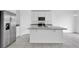 Open concept kitchen with island and stainless steel appliances at 416 Mckenna Dr, Winter Haven, FL 33881