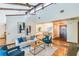 Open concept living room with hardwood floors, and view to dining area at 4834 Hall Rd, Orlando, FL 32817