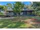 Single story home with large screened porch and deck at 4834 Hall Rd, Orlando, FL 32817
