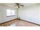Bright bedroom with wood floors and ceiling fan at 4834 Hall Rd, Orlando, FL 32817