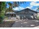 House exterior featuring a gray facade and a large garage at 4834 Hall Rd, Orlando, FL 32817