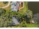 Aerial view of the property showing the house, pool, and lake access at 4834 Hall Rd, Orlando, FL 32817