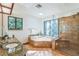 Spa-like bathroom with granite countertops, a shower, and a tub at 4834 Hall Rd, Orlando, FL 32817