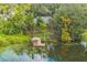 Private dock with gazebo overlooking a serene lake at 4834 Hall Rd, Orlando, FL 32817