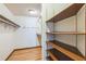 Large walk-in closet with shelving and hanging rods at 4834 Hall Rd, Orlando, FL 32817