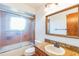 Clean bathroom with granite vanity and updated shower at 4834 Hall Rd, Orlando, FL 32817